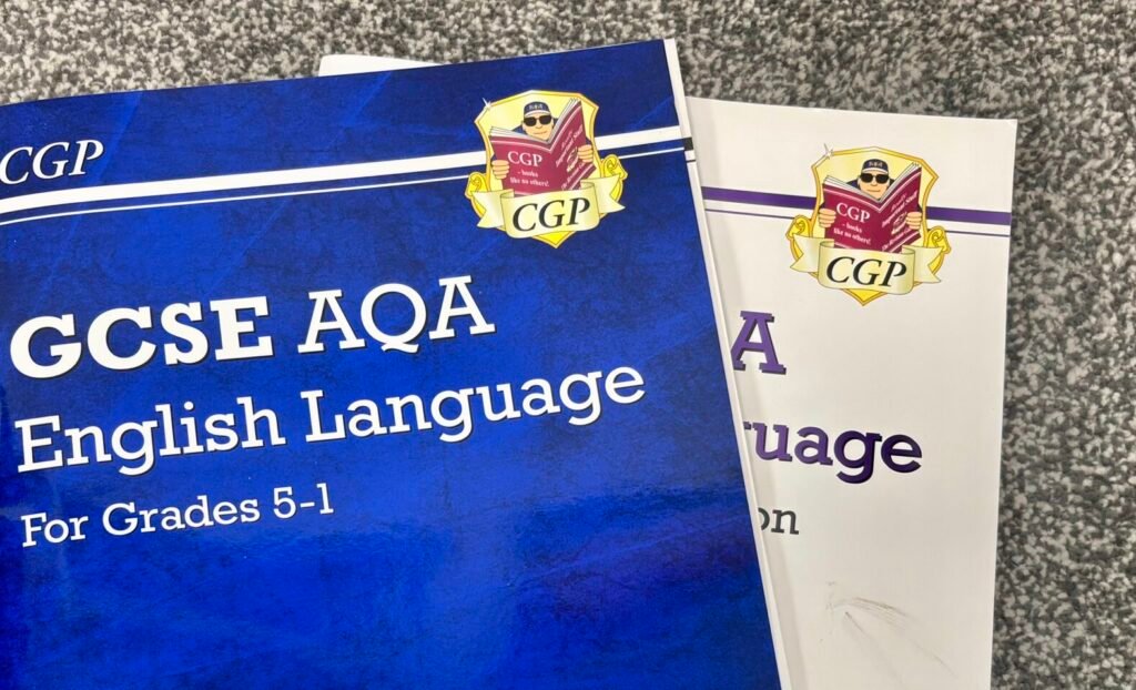 A close up of the GCSE AQA English Language textbook by CGP.