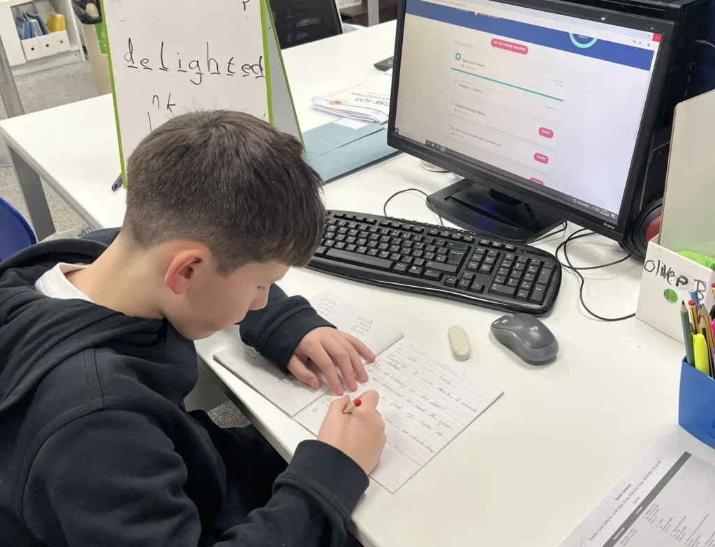 Ilkeston Tuition Centre student, Hugo, working at a desk