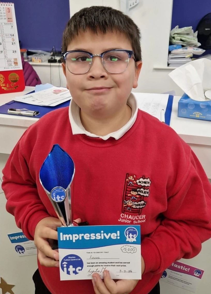 Lucas holding his award