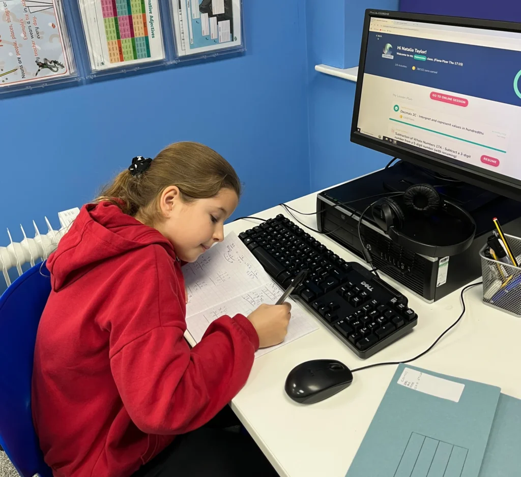 Ilkeston Tuition Centre student, Natalia, working at a desk
